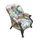 A 20th century mahogany show frame armchair, with upholstered with a hunting themed print, button