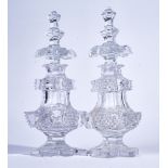 A PAIR OF TALL CUT GLASS SCENT BOTTLES AND STOPPERS (4)