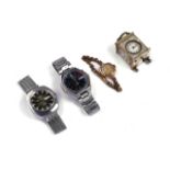 THREE WRISTWATCHES AND A MINIATURE CLOCK (4)