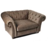 A 'GOSFORD PARK SUNGGLER' ARMCHAIR WITH BUTTON GREY UPHOLSTERY