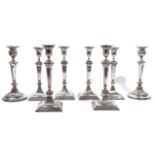 A SET OF FOUR SILVER PLATED ON COPPER TABLE CANDLESTICKS AND TWO FURTHER PAIRS OF CANDELSTICKS...