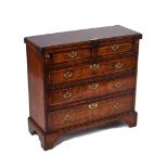 AN ADAPTED 18TH CENTURY FEATHER BANDED WALNUT BACHELOR’S CHEST