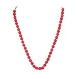 A SINGLE ROW NECKLACE OF CORAL BEADS