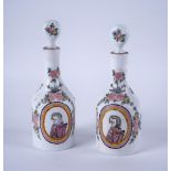 A PAIR OF BOHEMIAN MILCHGLAS DECANTERS AND STOPPERS (4)