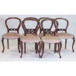 A SET OF SIX VICTORIAN MAHOGANY BALLOON BACK DINING CHAIRS