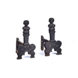 A PAIR OF BAROQUE STYLE CAST IRON ANDIRONS OR FIRE DOGS (2)