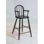 A CHILDS STAINED BEECH STICK BACK HIGH CHAIR