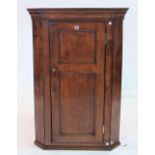 AN 18TH-CENTURY OAK HANGING CORNER CUPBOARD