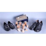 TWO PAIRS OF LEATHER CHILDREN'S SHOES, A TERRACOTTA DOG, AND A BOX OF DRAWING MODELS (5)