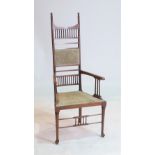 AN EARLY 20TH CENTURY ARTS AND CRAFTS MAHOGANY FRAMED HIGHBACK OPEN ARMCHAIR