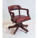 A STAINED BEECH RED LEATHER UPHOLSTERED TUB BACK OFFICE SWIVEL CHAIR