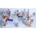 A GROUP OF THIRTEEN STAFFORDSHIRE FIGURES (13)