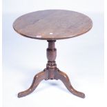 AN 18TH CENTURY OAK TRIPOD TABLE