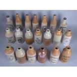 A GROUP OF TWENTY ASSORTED STONEWARE BOTTLES