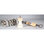AN IVORY HANDLED KNIFE SHARPNER, AN IVORY PEPPER GRINDER AND A HORN AND BONE MOUNTED BOX (3)