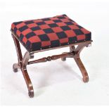 A LATE 19TH CENTURY MAHOGANY X-FRAME STOOL UPHOLSTERED FROM SOLDIERS UNIFORMS