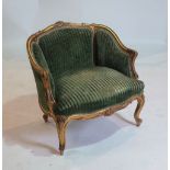 A LOUIS XV STYLE GILT WOOD FRAMED LOW ARMCHAIR