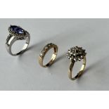 A 9CT GOLD AND DIAMOND CLUSTER RING AND TWO FURTHER RINGS (3)