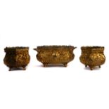 THREE ROCOCO STYLE EMBOSSED GILT-METAL JARDINIÈRES (3)