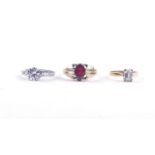 A 9CT GOLD AND GARNET RING AND TWO FURTHER RINGS (3)