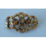 A VICTORIAN GOLD AND CITRINE BROOCH