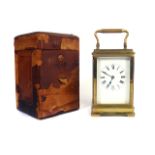 A FRENCH BRASS CASED CARRIAGE CLOCK WITH KEY AND OUTER CASE