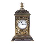 A BRASS MANTEL TIMEPIECE