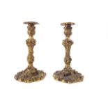 A PAIR OF ROCOCO REVIVAL ORMOLU CANDLESTICKS