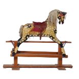 A GESSO PAINTED BEECH ROCKING HORSE