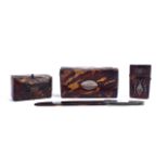 A GROUP OF THREE SILVER INLAID TORTOISESHELL VERTUE BOXES AND A LETTER OPENER