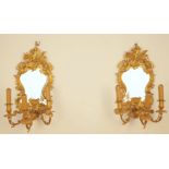 A PAIR OF GILT-METAL ROCOCO STYLE THREE-LIGHT GIRANDOLES (2)