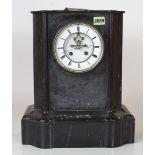 A 19TH CENTURY BLACK SLATE CASED 8-DAY MANTEL CLOCK WITH ENAMEL DIAL.