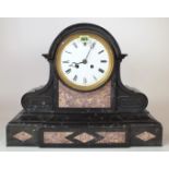 A 19TH CENTURY BLACK SLATE CASED 8-DAY MANTEL CLOCK WITH ENAMEL DIAL AND INLAID MARBLE...