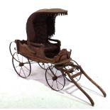 A 19TH CENTURY CHILDS DOG DRAWN CARRIAGE