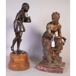 A FRENCH SPELTER SCULPTURE OF A SEATED FIGURE PERSONIFYING AUTUMN (2)