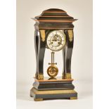 A FRENCH ORMOLU-MOUNTED EBONISED AND BOXWOOD OUTLINED PORTICO CLOCK OF UNUSUAL FORM