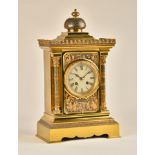 A FRENCH GILT, SILVERED AND PATINATED BRASS MANTEL CLOCK