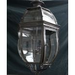 A HEXAGONAL GUN METAL COLOURED SHAPED LANTERN