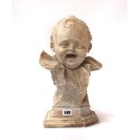 AN ITALIAN CARVED BUST OF A LAUGHING CHILD