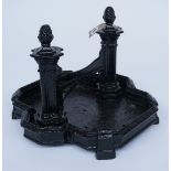 A 19TH CENTURY BLACK PAINTED CAST IRON BOOT SCRAPER WITH CLUSTER COLUMN AND ACORN FINIAL