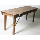 AN EARLY 20TH CENTURY PINE WORK BENCH