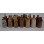 A QUANTITY OF EARLY 20TH CENTURY STONEWARE BOTTLES, VARIOUS LOCATIONS AND BREWERIES (QTY)