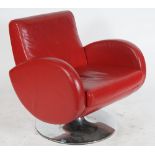 A MODERN RED LEATHER UPHOLSTERED ARMCHAIR