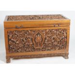 A MODERN CARVED HARDWOOD TRUNK