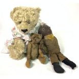 AN EARLY 20TH CENTURY JOINTED TEDDY BEAR, A STRAW FILLED DOLL AMERICAN DOLL AND A TEDDY BEAR (3)