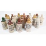 A QUANTITY OF EARLY 20TH CENTURY STONEWARE BOTTLES, VARIOUS LOCATIONS AND BREWERIES (QTY)