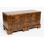 A LOW FIGURED WALNUT SHAPED SIX DRAWER CHEST