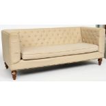 A MODERN CREAM UPHOLSTERED SQUARE BACK SOFA