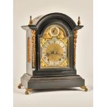 A LATE VICTORIAN ORMOLU-MOUNTED EBONISED QUARTER STRIKING MANTEL CLOCK