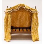 AN EARLY 20TH CENTURY NOVELTY CAT BED FORMED AS A BOBBIN TURNED FOUR POSTER BED